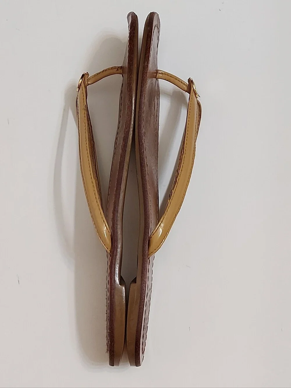 Tory Burch Brown Leather Flip Flop Sandals with Tan Straps and Gold Medallion